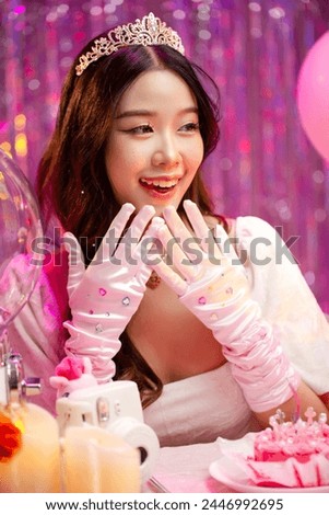 Happy beautiful Asian girl in princess dress showing birthday cake. Birthday princess photography theme is popular in social network. Royalty-Free Stock Photo #2446992695