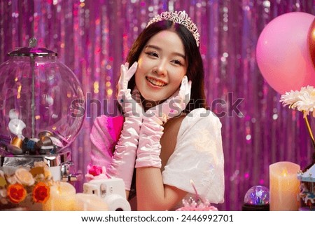 Happy beautiful Asian girl in princess dress showing birthday cake. Birthday princess photography theme is popular in social network. Royalty-Free Stock Photo #2446992701