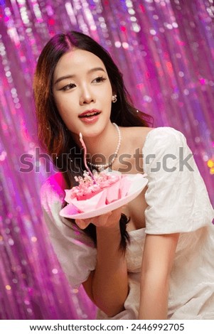 Happy beautiful Asian girl in princess dress showing birthday cake. Birthday princess photography theme is popular in social network. Royalty-Free Stock Photo #2446992705