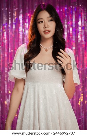 Happy beautiful Asian girl in princess dress. Birthday princess photography theme is popular in social network. Royalty-Free Stock Photo #2446992707