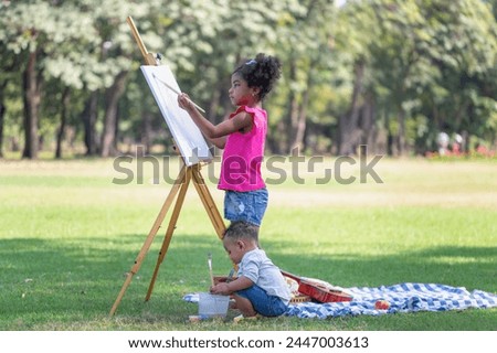 Crafts and DIY with people, Kid girl sister and little boy brother painting in the park