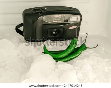 green chilies and an old analog camera