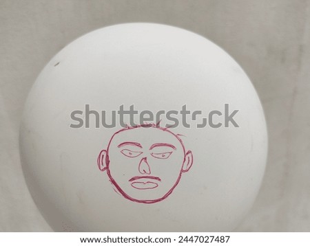 Make human cartoon face with red pencil On white Balloon,Balloon arts with human photo pencil art, emoji face isolated on balloon 