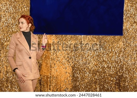 Woman host of a wedding festive ceremony.Blue place for text on gold                               