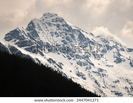 View of the Snow Covered Mountain Peaks and Forest at North Cascades National Park in Washington State, USA Royalty-Free Stock Photo #2447041371