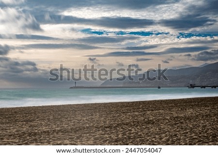 Long exposure captures the serene Mediterranean coast from Zapillo Beach in Almeria, Andalusia.