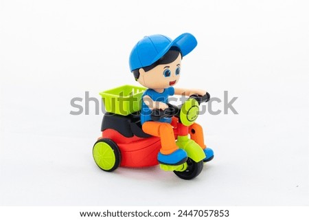 Child riding cycle toy for kids on white background