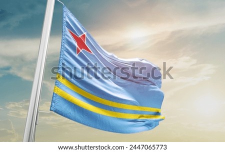 Aruba national flag waving in the sky.