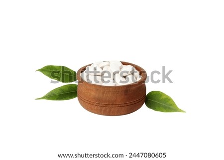 PNG,Collagen tablets in a bowl, isolated on white background