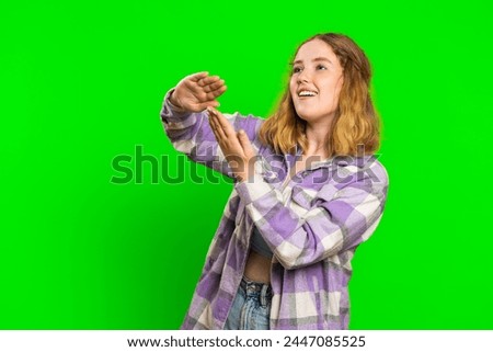 Young woman showing wasting throwing sharing money around, more tips, big profit, winning lottery jackpot, successful shopping payment purchase cashback. Redhead girl isolated on chroma key background