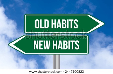 Old habits or new habits road sign on cloudy sky background