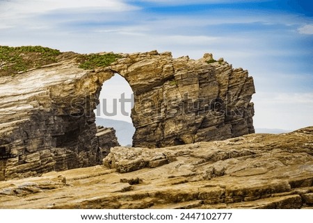 Cliff formations on Cathedral Beach in Galicia Spain. Playa de las Catedrales, As Catedrais in Ribadeo, province of Lugo. Cantabric coastline in northern Spain. Tourist attraction. Royalty-Free Stock Photo #2447102777