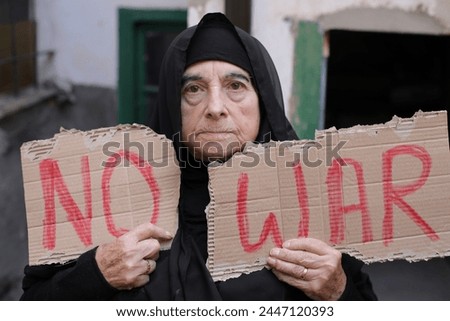 Peaceful activist with anti war sign 