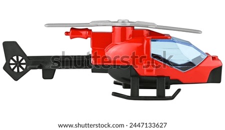 Red toy helicopter isolated on a white background. Side view.