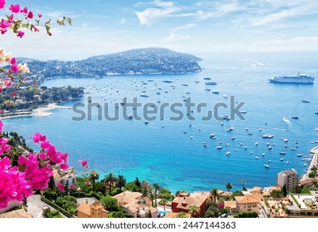 landscape of riviera coast, turquiose water and blue sky of cote dAzur at sunny summer day, France, toned Royalty-Free Stock Photo #2447144363