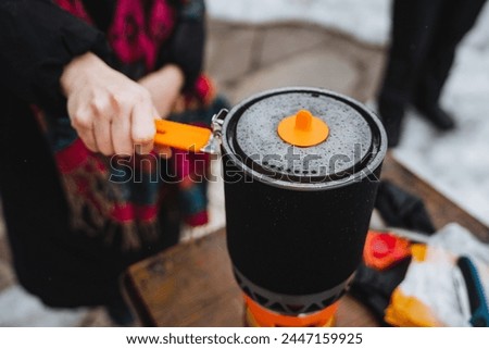 camping pot for gas burner, camping gas, cooking in nature, hiking in the forest, thermo pot, camping utensils. High quality photo