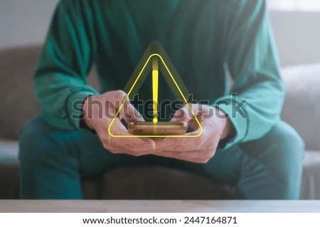 Risk and cyber security on internet network Businessman using smartphone with triangle caution warning exclamation sign for notification error and maintenance concept