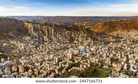 La Paz, Bolivia, aerial view flying over the dense, urban cityscape. San Miguel, southern distric. South America Royalty-Free Stock Photo #2447166731