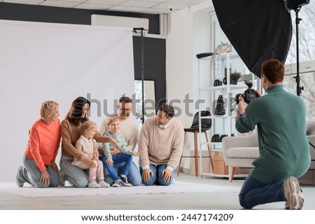 Big family having photo shoot in studio