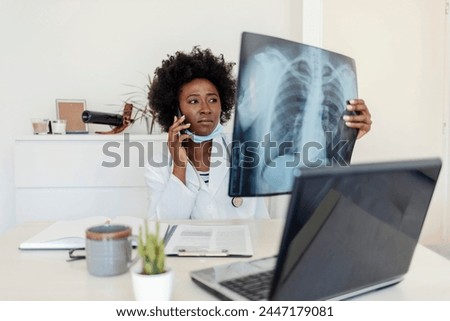 Female doctor diagnosing patients health on asthma, lung disease, COVID-19, coronavirus or bone cancer illness with radiological chest x-ray film for medical healthcare hospital service.