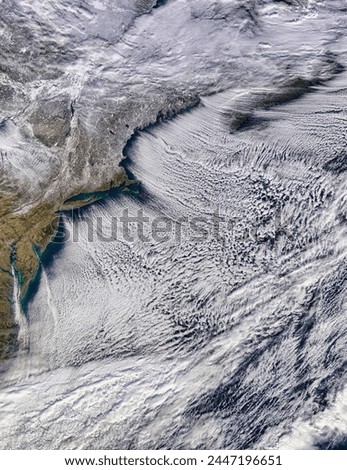 Cloud streets off the northeastern United States. Cloud streets off the northeastern United States. Elements of this image furnished by NASA.