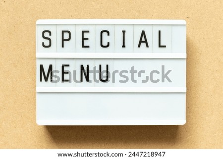 Lightbox with word special menu on wood background