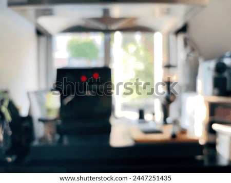 Blur focus of  coffee machine with cup in office. Space for text