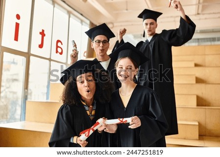 Multicultural students in graduation gowns and caps happily posing for a picture after completing their academic journey.