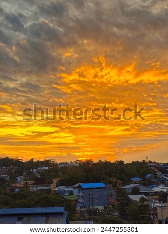 sunrise with view hill and the sky is orange colour