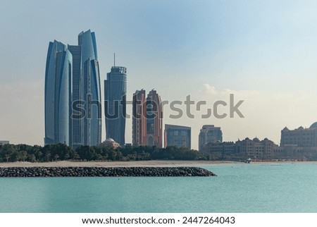 A picture of the Etihad Towers and the Emirates Palace Mandarin Oriental Hotel.