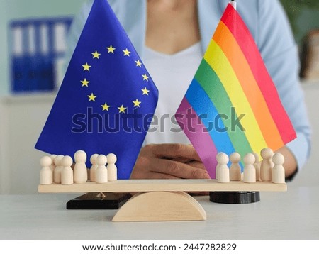 European Union, EU flags and rainbows, conceptual picture about human rights and confrontation. LGBT rights in Europe and homophobia