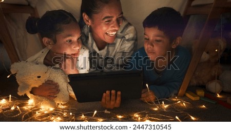 Funny, tablet and mother with children in a tent house streaming internet video, show or movie online in the night. Dark, digital and parent or dad relax with kids watching comedy in the evening