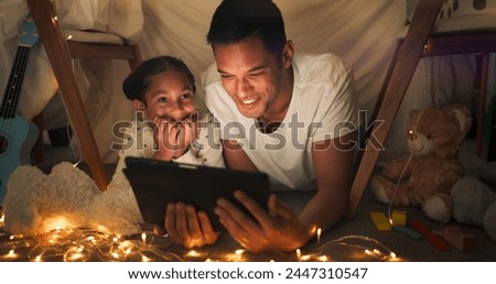 Tent, father and girl on tablet at night watching movies, online games and cartoon with fairy lights. Happy family, blanket and dad with child in bedroom on digital tech for bonding, relax and love