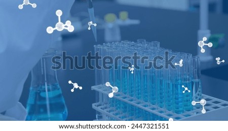 Image of molecules over caucasian scientist holding test tubes in lab. Science, computing and digital interface concept digitally generated image.