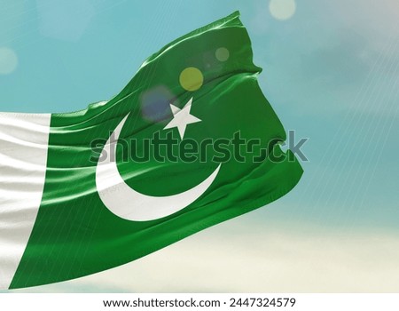 Pakistan national flag waving in beautiful sky. 14th august happy Independence Day.