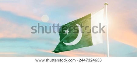Pakistan national flag waving in beautiful sky. 14th august happy Independence Day.