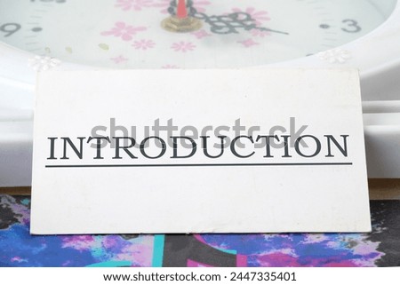 Business concept. Introduction Word written on a white business card