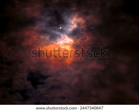 Solar eclipse in Canada on April 8, 2024. Beautiful view of the eclipse and clouds in the sky