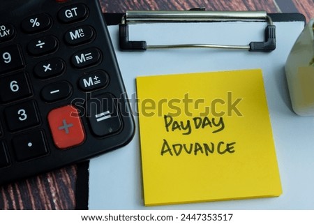 Concept of Payday Advance write on sticky notes isolated on Wooden Table.