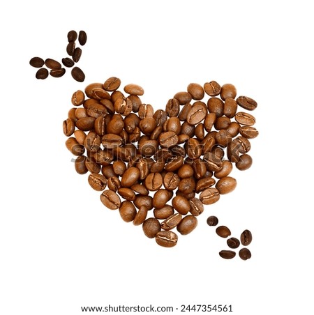 Many whole coffee beans laid out in arrow pierced heart shape isolated on white. High quality grains heap top view. Cute photo for cosmetic packaging layout design, advertising concept. Energy source