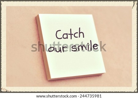Text catch our smile on the short note texture background