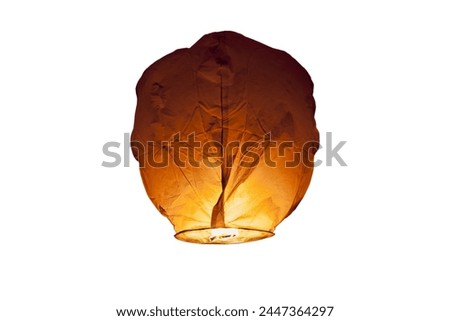 Immerse yourself in the enchanting glow of floating lanterns, isolated against a serene white background. Let their ethereal beauty illuminate your creative projects today! Royalty-Free Stock Photo #2447364297