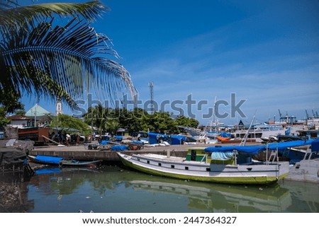 Traditional wooden boats anchor at Paotere Traditional Harbor in Makassar.  Royalty-Free Stock Photo #2447364327