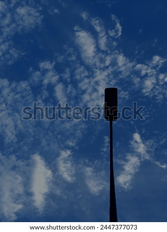 A beautiful picture of a street lamp captured in pleasant weather.