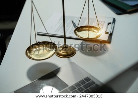scales and auction hammer, the team meeting at the law firm behind the concept of in office law.