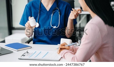 Female doctor using clipboard is delivering great news talk discuss results or symptoms with female patient in clinic or hospital office.