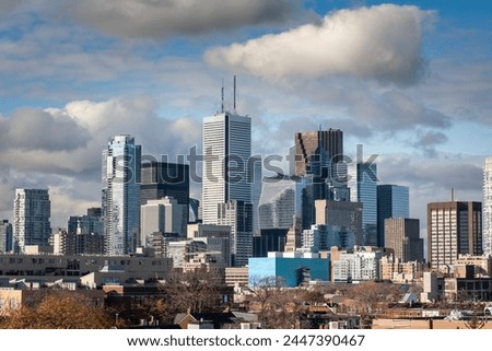Toronto skyline, with the iconic towers and buildings of the Downtown and the CBD business skyscrapers taken from afar. Toronto is a North American finance hub in Canada.