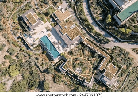 Hotel with long terraces and swimming pools. Amanzoe, Peloponnese, Greece. Top view