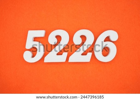 Orange felt is the background. The numbers 5226 are made from white painted wood.