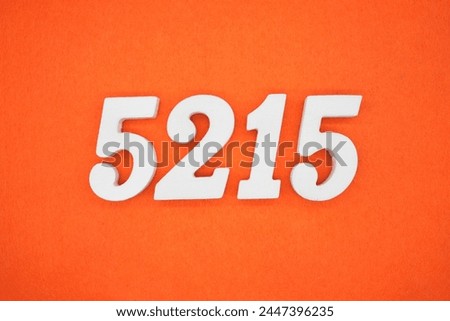 Orange felt is the background. The numbers 5215 are made from white painted wood.